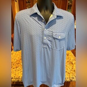 Criquet men’s golf polo. Sharp‎ Light Blue print w/logo on chest/sleeve. Medium